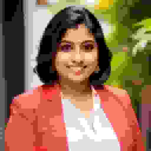 indian female headshot with red blazer
